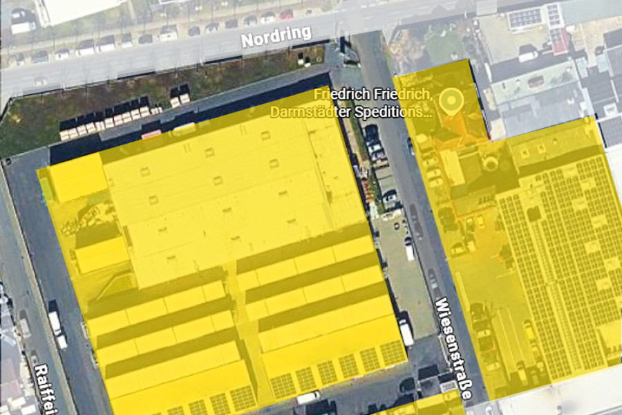 Luftaufnahme des Firmengeländes von Friedrich Friedrich in Griesheim mit farblich markierten Gebäudebereichen und Erweiterungsflächen.